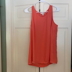 Tank with ruffles on bottom.